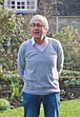 DR RONALD MACKENZIE  OXFORDSHIRE: DR RONALD MACKENZIE IN HIS GARDEN IN JANUARY