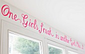 TARA NASH-KING HOUSE  LONDON: PINK LETTERING IN THE SHOE SALES AREA OF TARA NASH-KINGS HOME - ONE GIRLS FREAK IS ANOTHER GIRLS CHIC