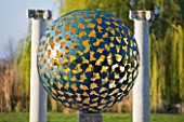 DAVID HARBER SUNDIALS: EARLY MORNING IMAGE OF THE MANTLE  A VERDIGRIS BRONZE SPHERE CONSISTING OF DOZENS OF INDIVIDUAL BRONZE PETALS WELDED TOGETHER