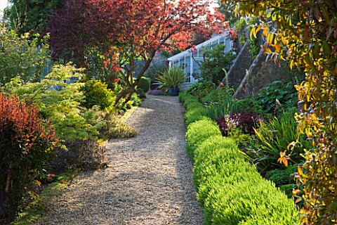 GRANGE_COURT__GUERNSEY_GRAVEL_PATH_WITH_ORIGINAL_GLASSHOUSE_OR_VINERY