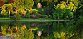 STOURHEAD LANDSCAPE GARDEN  WILTSHIRE: THE NATIONAL TRUST. MAY 2012 - PANORAMIC SUNSET VIEW ACROSS LAKE WITH REFLECTIONS AND TEMPLE OF APOLLO
