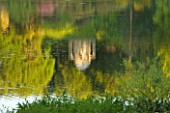 STOURHEAD LANDSCAPE GARDEN  WILTSHIRE: THE NATIONAL TRUST. MAY 2012 - SUNSET REFLECTIONS ON VIEW  LAKE WITH REFLECTION OF THE TEMPLE OF APOLLO
