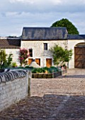 CHATEAU DU RIVAU  LOIRE VALLEY  FRANCE: VIEW OF POTAGER IN THE MAIN COURTYARD SEEN FROM THE DRAWBRIDGE