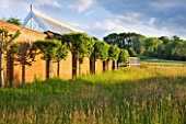 GIPSY HOUSE  BUCKINGHAMSHIRE: THE MEADOW WITH THE WALLED GARDEN AND GLASSHOUSE
