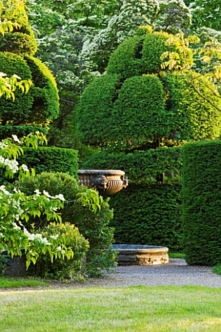 NYMANS__SUSSEX_THE_NATIONAL_TRUST__VIEW_TO_TOPIARY__CLIPPED_YEW_AND_ITALIAN_MARBLE_FOUNTAIN_WALL_GAR