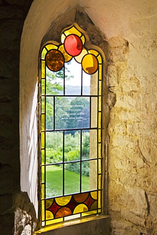 PAINSWICK_ROCOCO_GARDEN__GLOUCESTERSHIRE_STAINED_GLASS_IN_A_WINDOW_IN_THE_RED_HOUSE