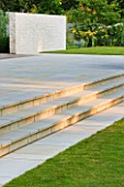 DEW POND HOUSE: DESIGN BY WILSON MCWILLIAM STUDIO - STEPS UP TO SANDSTONE PATIO WITH RENDERED WALL