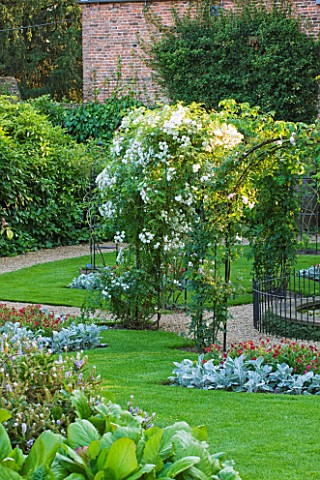PECKOVER_HOUSE__WISBECH__CAMBRIDGESHIRE_THE_NATIONAL_TRUST__ALEXAS_ROSE_GARDEN_WITH_ARCHES_OF_ROSA_S