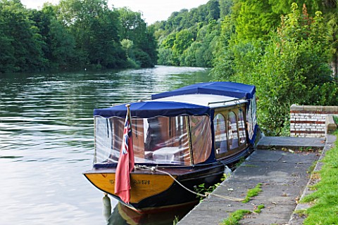 THE_NATIONAL_TRUST_CLIVEDEN__BUCKINGHAMSHIRE_BOAT_BY_THE_BOAT_HOUSE_AND_RIVER_THAMES__AUGUST