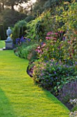 THE NATIONAL TRUST: CLIVEDEN  BUCKINGHAMSHIRE: BORDER WITH ECHINACEAS  IN THE LONG GARDEN  EVENING LIGHT