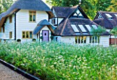 THE BOAT HOUSE: DESIGNER ARLETTE GARCIA - WILDFLOWER MEADOW BY THE HOUSE