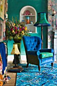 VELVET ECCENTRIC: NEW COUNTRY LOOK - BLUE RETRO CARPET  VELVET BLUE CHAIR BY VELVET ECCENTRIC  GREEN VINTAGE JARDINIERE  1930S GYPSY DOOR CURTAINS