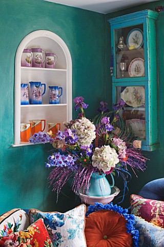 VELVET_ECCENTRIC_NEW_COUNTRY_LOOK__PERSIAN_GREEN_GLAZED_WALLS__FAUX_FLOWER_DISPLAY_FROM_BURFORD_GARD