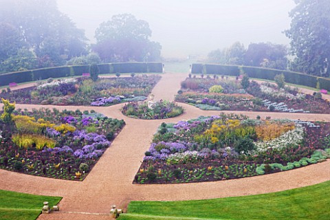RAGLEY_HALL_GARDEN__WARWICKSHIRE_THE_ROSE_GARDEN_IN_MIST_SEEN_FROM_THE_ROOF_OF_THE_HALL