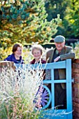 THE PICTON GARDEN  WORCESTERSHIRE: PAUL  MURIEL AND HELEN PICTON BESIDE THE ENTRANCE TO THE GARDEN