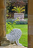 HEVER CASTLE  KENT: AUTUMN: VIEW THROUGH COLUMNS IN THE LOGGIA TO PALM IN LARGE TERRACOTTA CONTAINER ON LAWN IN ITALIAN GARDENS