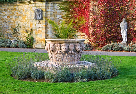 HEVER_CASTLE__KENT_AUTUMN_LARGE_TERRACOTTA_CONTAINER_WITH_PALM_AND_ITALIAN_STATUE_AND_BOSTON_IVY__PA