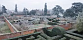 HAMPTON COURT CASTLE AND GARDENS  HEREFORDSHIRE: VIEW FROM THE GOTHIC TOWER ACROSS THE YEW MAZE TO THE WALLED GARDEN IN FROST WITH THE ISLAND PAVILIONS AND COURT BEHIND