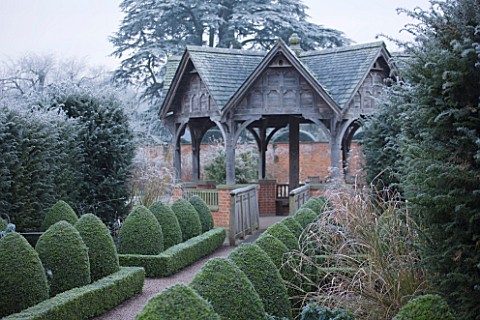 HAMPTON_COURT_CASTLE_AND_GARDENS__HEREFORDSHIRE_THE_WALLED_GARDEN_IN_FROST__VIEW_ALONG_PATH_TO_ISLAN