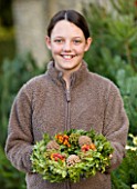 THE GARDEN AND PLANT COMPANY  HATHEROP  GLOUCESTERSHIRE: EMILY WITH FOLIAGE  BERRY AND CONE WREATH