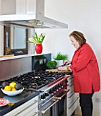 SHELLEY VON STRUNCKEL APARTMENT  LONDON: SHELLEY IN HER KITCHEN AREA WITH A FALCON COOKER