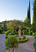 LA CASELLA, FRANCE: PATIO / TERRACE WITH COBBLES, BOX BALLS IN CONTAINERS, BOX EDGED FOUNTAIN / POOL / POND, FASTIGIATE CYPRESS TREES. PATIO, MEDITERRANEAN, FRENCH, FORMAL, GREEN