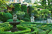 LA CASELLA, FRANCE: GREEN PARTERRE, FOUNTAIN, CLIPPED, TOPIARY, MEDITERRANEAN, FRENCH, FORMAL, EVERGREENS, SUMMER, PROVENCE, HEDGES, HEDGING, BOX, BUXUS, WHITE WISTERIA