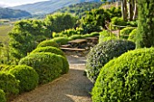 LA CARMEJANE, FRANCE: LUBERON, PROVENCE, FRENCH, COUNTRY, GARDEN, SUMMER, CLIPPED, TOPIARY, BALLS, HEDGING, TERRACE, TABLE, CHAIRS, VIEW, COUNTRYSIDE, BORROWED, LANDSCAPE
