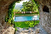 LA CARMEJANE, FRANCE: LUBERON, PROVENCE, FRENCH, COUNTRY, GARDEN, SUMMER, CAVE, GRASS, LAWN, SWIMMING POOL