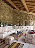 GARDEN IN LUBERON  FRANCE  DESIGNED BY MICHEL SEMINI: - WASSERMAN GARDEN - POOL HOUSE WITH WRATTAN FURNITURE AND SETTEES