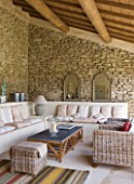 GARDEN IN LUBERON  FRANCE  DESIGNED BY MICHEL SEMINI: - WASSERMAN GARDEN - POOL HOUSE WITH WRATTAN FURNITURE AND SETTEES