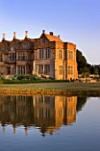BROUGHTON CASTLE, OXFORDSHIRE: VIEW OF CASTLE ACROSS LAKE WITH REFLECTIONS - REFLECTION, COUNTRY GARDEN, CLASSIC, SUMMER, REFLECTED
