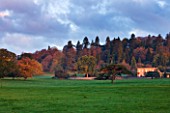 KILLERTON, DEVON: THE NATIONAL TRUST: VIEW OF HOUSE AND SURROUNDING LANDSCAPE PARK IN AUTUMN