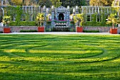 ARUNDEL CASTLE GARDENS  WEST SUSSEX: THE COLLECTOR EARLS GARDEN: LAWN WITH PATH CUT INTO IT AND WOODN PERGOLA BEYOND