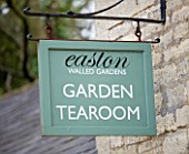 EASTON WALLED GARDEN  LINCOLNSHIRE: PAINTED SIGN WELCOMING VISITORS TO THE GARDEN TEAROOM