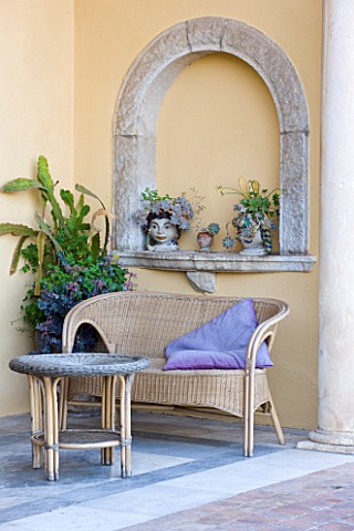 SICILY__ITALY_CASA_CUSENI_IN_TAORMINA__MARBLE_TERRACE__PATIO_WITH_WICKER_SEAT__BENCH_AND_TABLE_AND_C