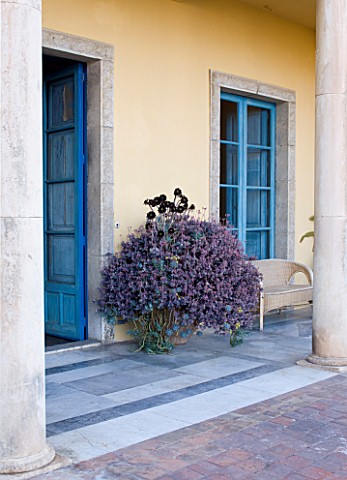 SICILY__ITALY_CASA_CUSENI_IN_TAORMINA__TERRACOTTA_AND_MARBLE_TILED_TERRACE__PATIO_WITH_BLUE_DOORS_AN