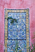 SICILY  ITALY: CASA CUSENI IN TAORMINA - UPPER TERRACE - ANCIENT HAND PAINTED SICILIAN AND TUNISIAN TILES ON PAINTED WALL BESIDE POOL - 500 YEARS OLD  MOSAIC  ORNAMENT