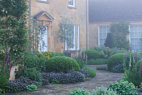 ROCKCLIFFE_HOUSE_GLOUCESTERSHIRE_THE___GREEN_COUNTRY_GARDEN_ROMANTIC_MIST_FOG__TERRACE__PATIO_WITH_F
