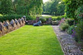 BIRTSMORTON COURT, WORCESTERSHIRE: TERRACE BESIDE THE HOUSE WITH LAWN AND SCULPTURE OF WILD BOAR - SUMMER, JUNE, ENGLISH GARDEN, CLASSIC
