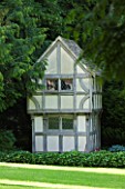 BIRTSMORTON COURT, WORCESTERSHIRE: SMALL WENDY HOUSE IN THE WOODS - GARDEN ORNAMENT, SUMMER, WOODLAND, BUILDING, FOLLY