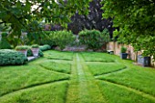 POULTON HOUSE GARDEN, WILTSHIRE: SYMMETRICAL GRASS PATHS IN LAWN IN ORCHARD