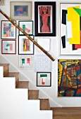 BEN DE LISI HOUSE AND GARDEN  LONDON: THE STAIRS WITH NO BANISTER  BAMBOO STAIR RAIL  ARTWORKS ON WALL AND AMERICAN WALNUT FLOORING