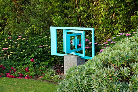 LE_HAUT_GUERNSEY_KINETIC_SCULPTURE_BY_IVAN_BLACK_AT_BACK_OF_LAWN__THE_SLIGHTEST_BREATH_OF_AIR_SETS_I