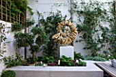 DESIGNER STEPHEN WOODHAMS, LONDON: ROOF GARDEN - RAISED BEDS, COTSWOLD STONE SCULPTURE BY TOM STOGDON. PATIO, TERRACE, FORMAL, ORNAMENT, CLASSIC, FOCAL POINT