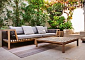 DESIGNER STEPHEN WOODHAMS, LONDON: ROOF GARDEN - RAISED BEDS, DECK, DECKING, SOFA, CHAIR, SEAT, BENCH, WOODEN TABLE, PATIO, TERRACE, ENTERTAINING, A PLACE TO SIT, SMALL TOWN GARDEN