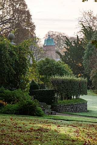 HOLKER_HALL__CUMBRIA_THE_HALL_SEEN_FROM_THE_WOODLAND__AUTUMN