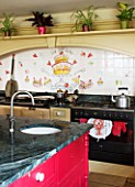 BRILLS FARM  LINCOLNSHIRE: THE KITCHEN WITH TILES PAINTED BY KATE GLANVILLE