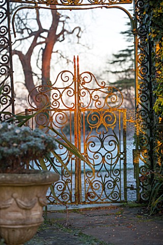SEDGWICK_PARK_WEST_SUSSEX_ORNATE_CAST_IRON_ENTRANCE_GATE_FOR_GARDEN_VISITORS_METAL_JANUARY_RUSTED_WI