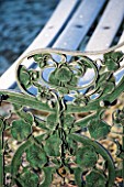 SEDGWICK PARK, WEST SUSSEX. DETAIL OF ORNATE METAL BENCH WITH FLORAL DESIGN, FROST, WINTER, JANUARY.